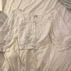 Women’s American Eagle white, long sleeve off the shoulder crop top.